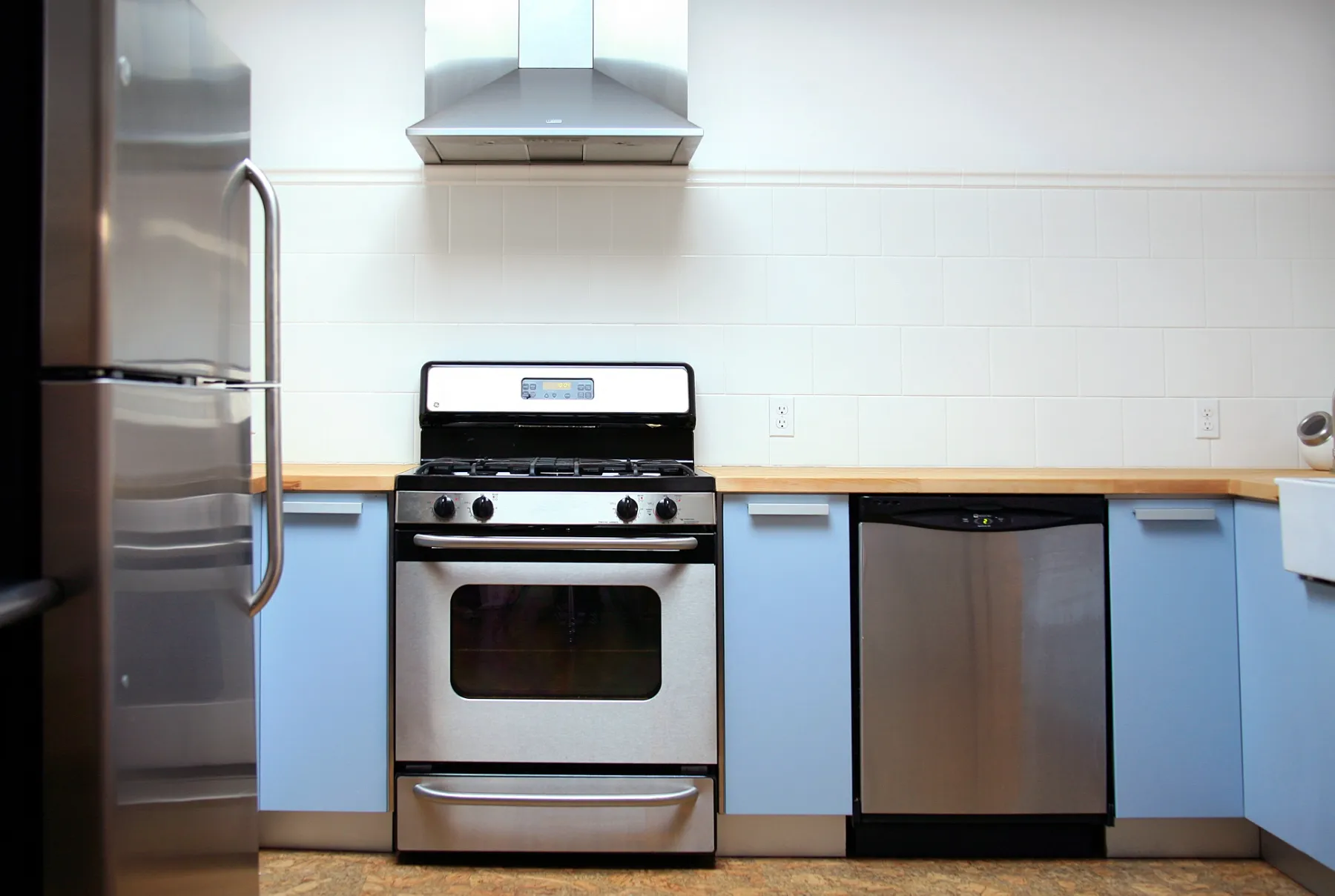 Full kitchen for food styling and catering at the Light Loft — gas range, hood, refrigerator and dishwasher